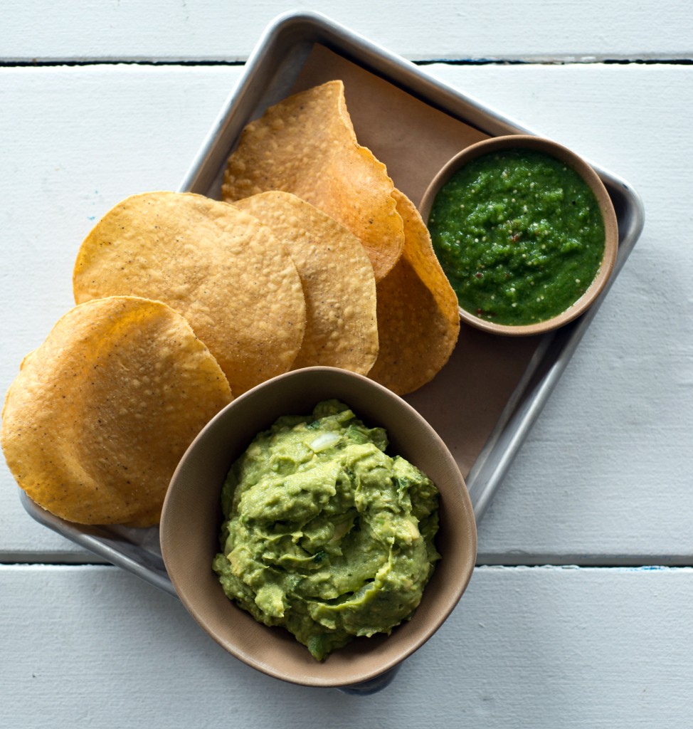 Guacamole dip, salsa verde and chips from bartaco